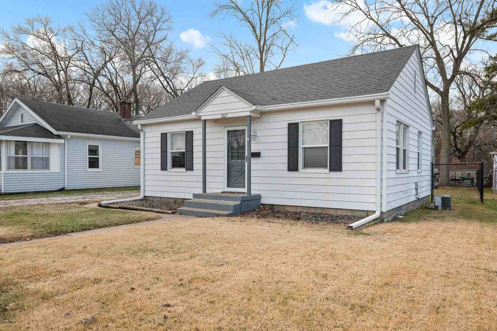 2517 3rd Street East Moline, IL 61244 - Photo 2 of 22 a view of a house with a yard and large tree
