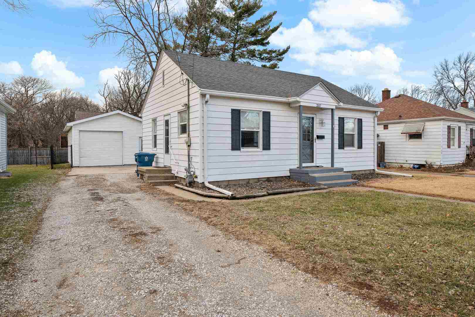 2517 3rd Street East Moline, IL 61244 - Photo 3 of 22 a front view of a house with a yard