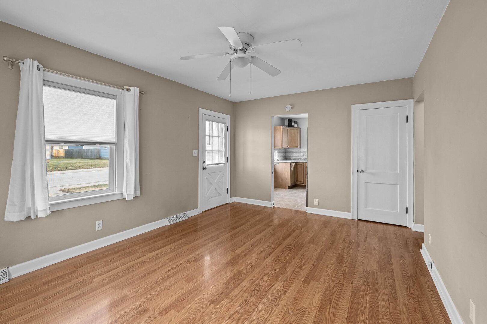 2517 3rd Street East Moline, IL 61244 - Photo 5 of 22 a view of an empty room with a window and wooden floor