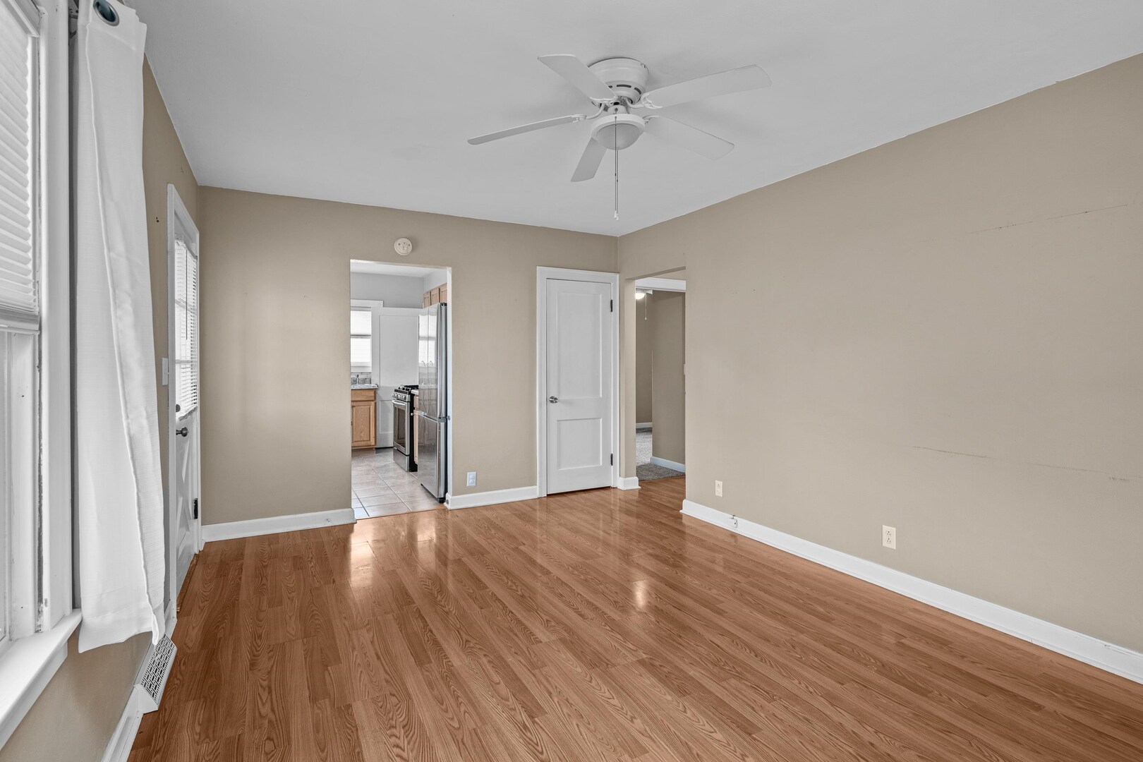 2517 3rd Street East Moline, IL 61244 - Photo 6 of 22 a view of a big room with wooden floor and windows