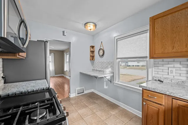 a kitchen with a stove and a sink