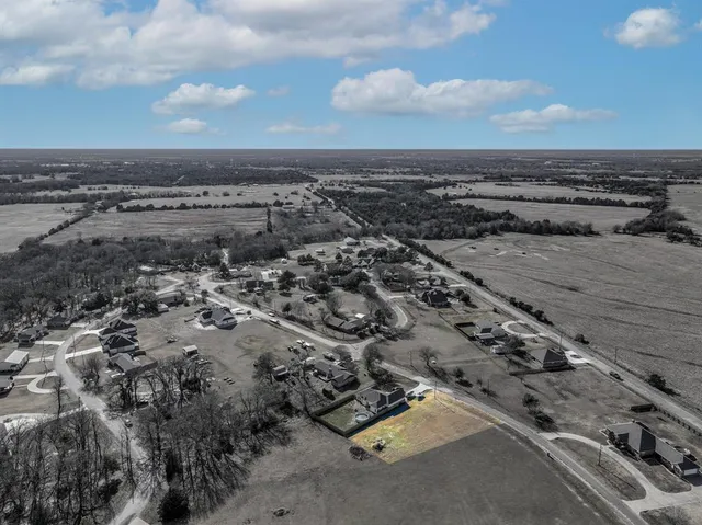 an aerial view of a parking space and city view