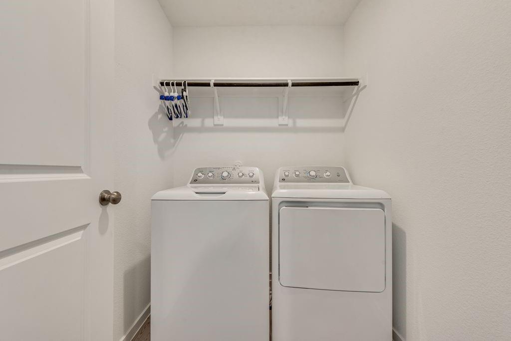14112 Hammersmith Street Pilot Point, TX 76258 - Photo 14 of 19 a utility room with dryer and washer