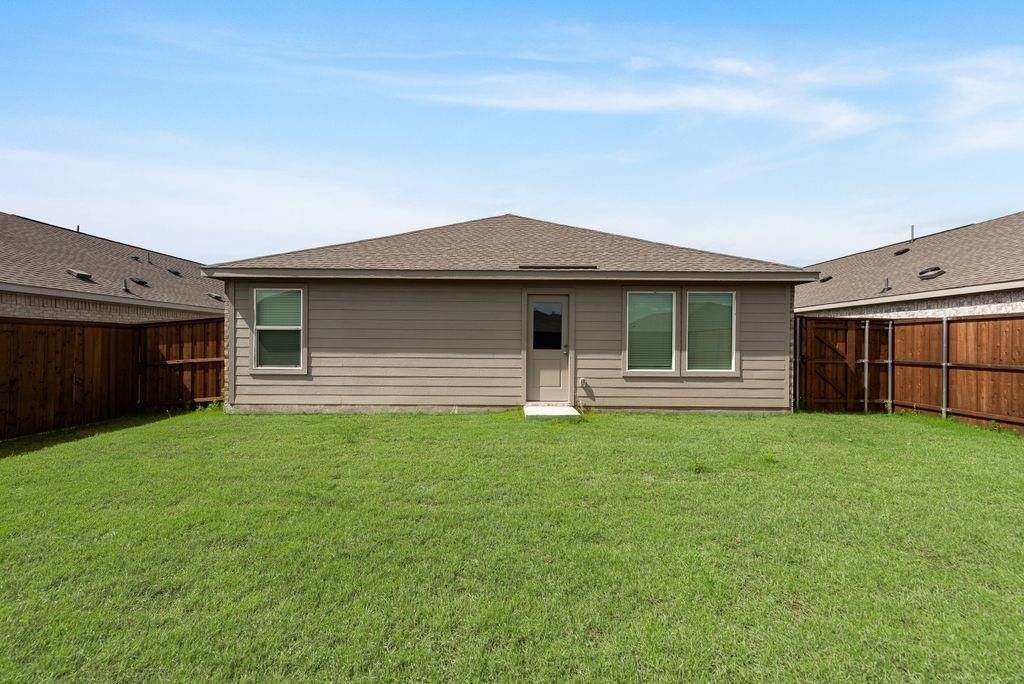 14112 Hammersmith Street Pilot Point, TX 76258 - Photo 19 of 19 a front view of a house with a yard