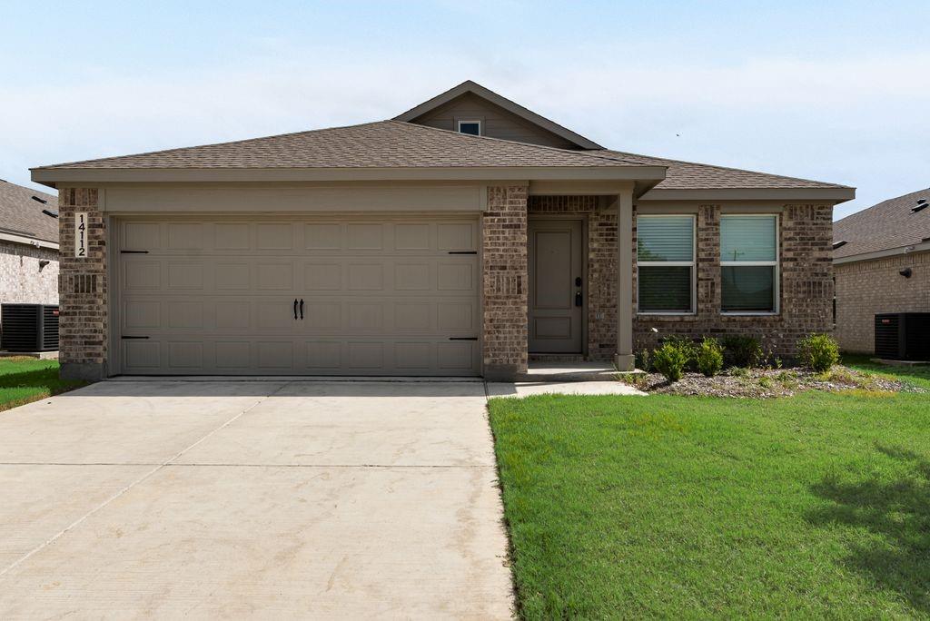 14112 Hammersmith Street Pilot Point, TX 76258 - Photo 2 of 19 a front view of a house with a yard