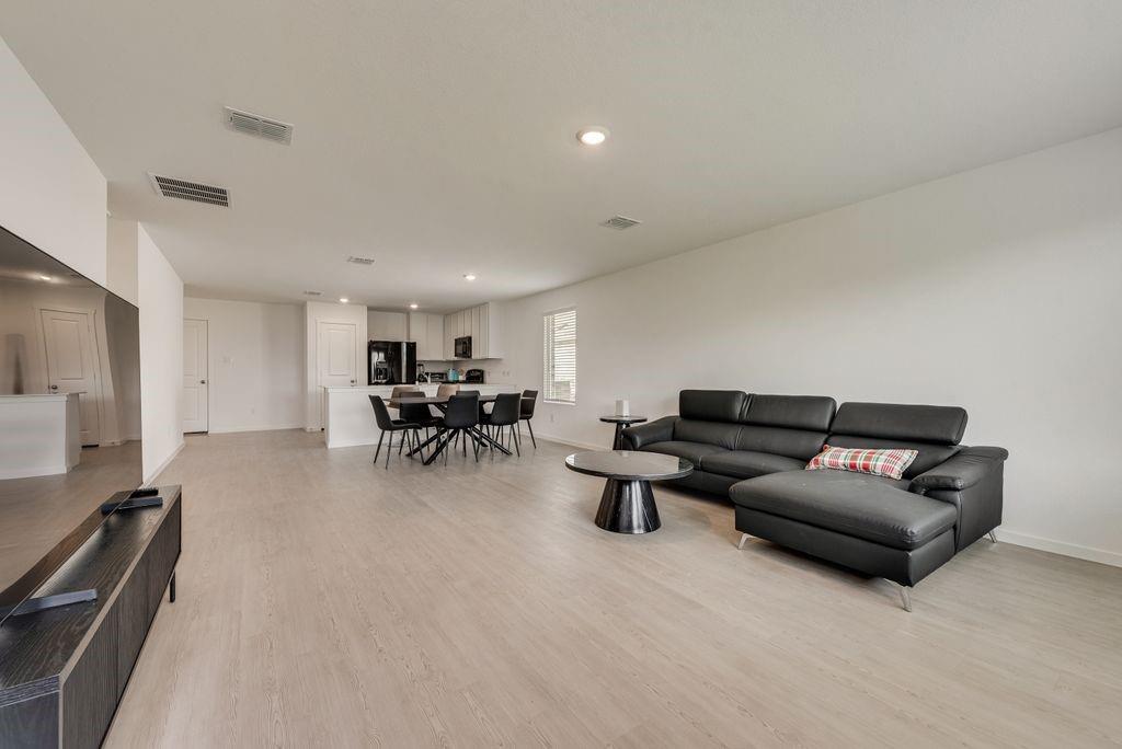 14112 Hammersmith Street Pilot Point, TX 76258 - Photo 10 of 19 a living room with furniture and a table