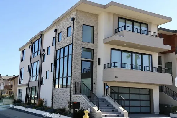 a front view of a house with a balcony