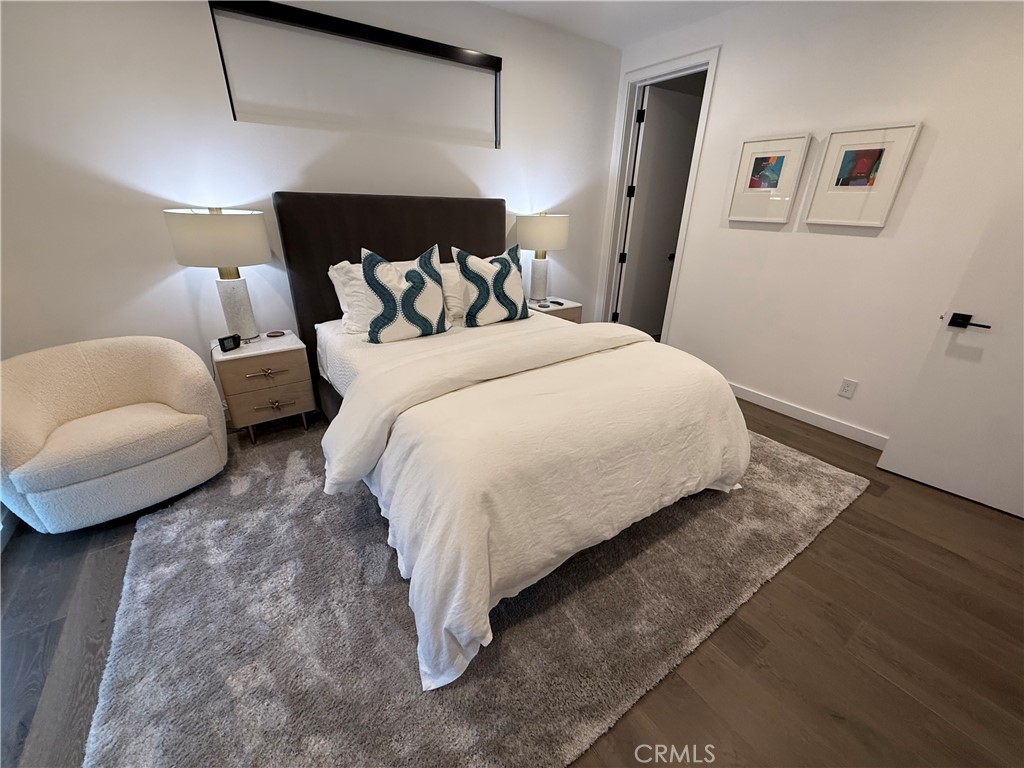 116 West Channel Islands Boulevard Oxnard, CA 93035 - Photo 24 of 60 a bedroom with a bed and a couch