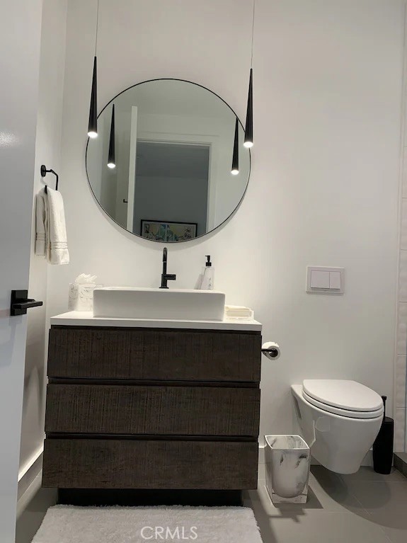 116 West Channel Islands Boulevard Oxnard, CA 93035 - Photo 27 of 60 a bathroom with a toilet a sink and mirror