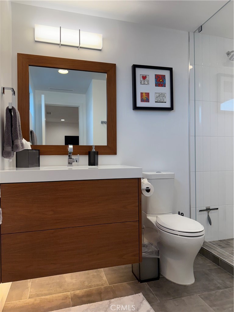 116 West Channel Islands Boulevard Oxnard, CA 93035 - Photo 35 of 60 a bathroom with a toilet sink and mirror
