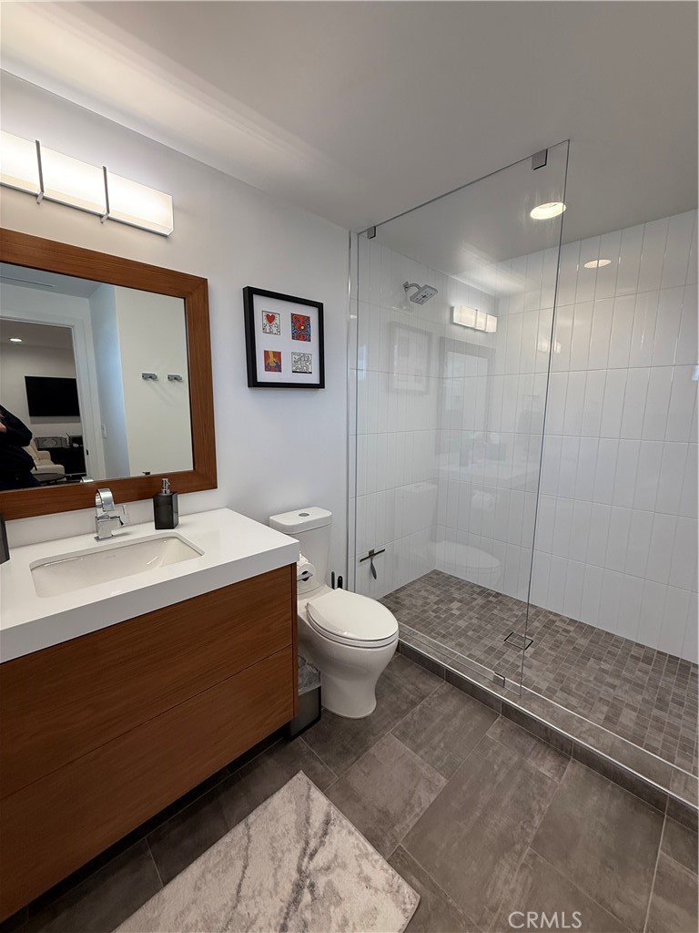 116 West Channel Islands Boulevard Oxnard, CA 93035 - Photo 36 of 60 a bathroom with a sink a toilet and a mirror