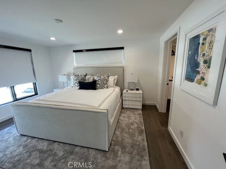 116 West Channel Islands Boulevard Oxnard, CA 93035 - Photo 39 of 60 a room with a bed and a mirror