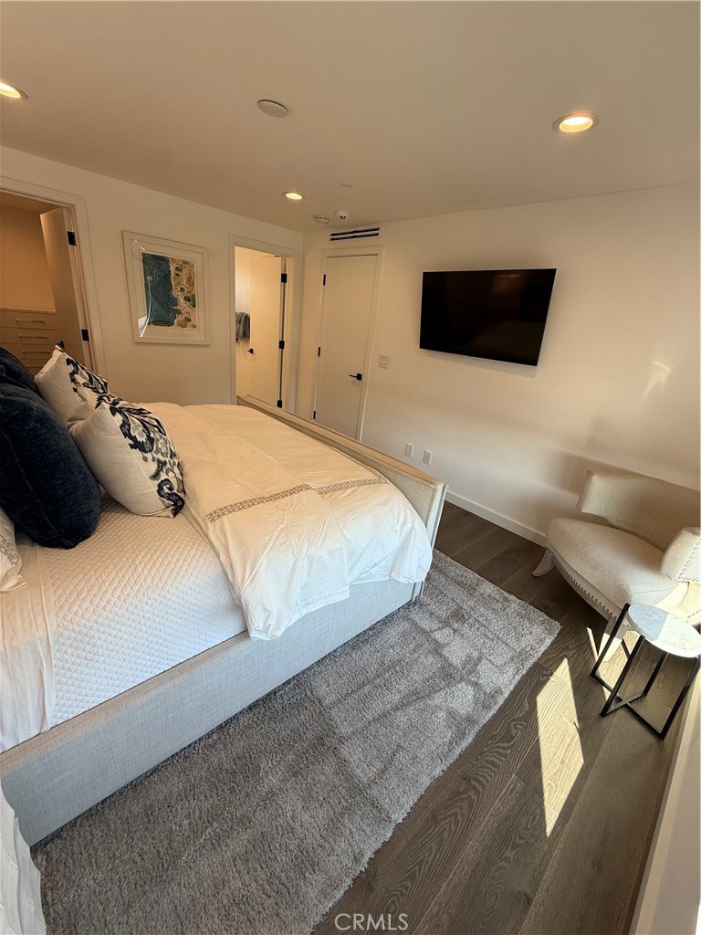 116 West Channel Islands Boulevard Oxnard, CA 93035 - Photo 40 of 60 a bedroom with a bed and a flat screen tv