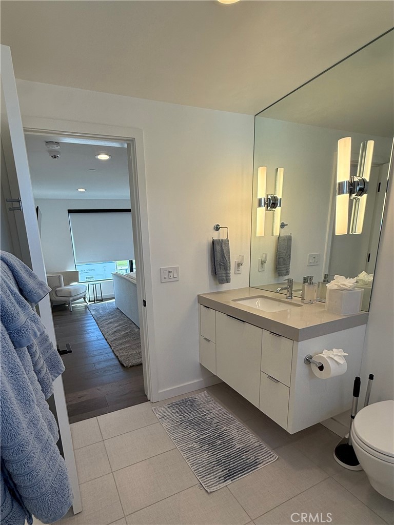 116 West Channel Islands Boulevard Oxnard, CA 93035 - Photo 43 of 60 a bathroom with a double vanity sink mirror and bathtub