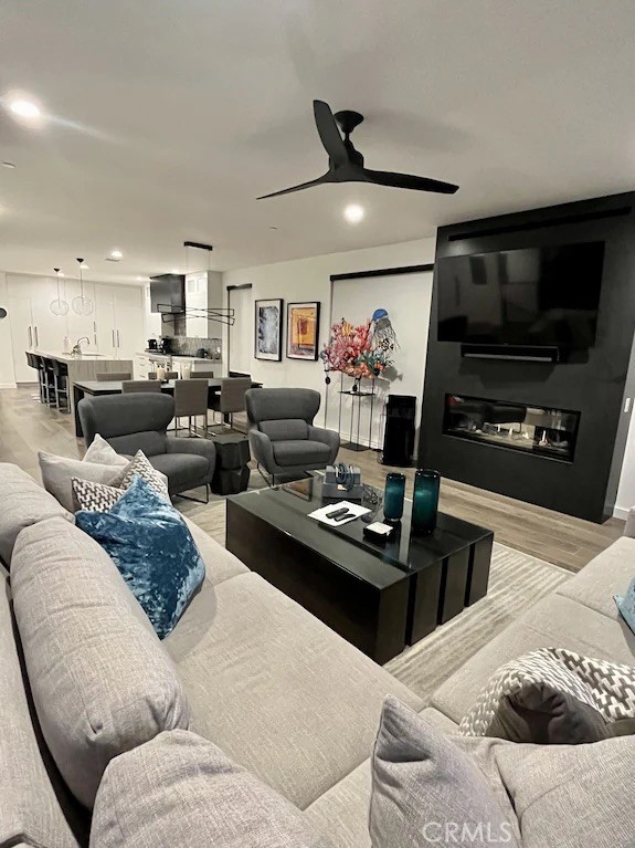 116 West Channel Islands Boulevard Oxnard, CA 93035 - Photo 8 of 60 a living room with furniture and a flat screen tv