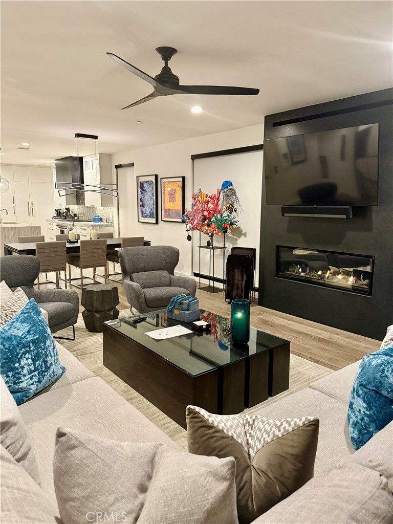 116 West Channel Islands Boulevard Oxnard, CA 93035 - Photo 10 of 60 a living room with furniture and a flat screen tv