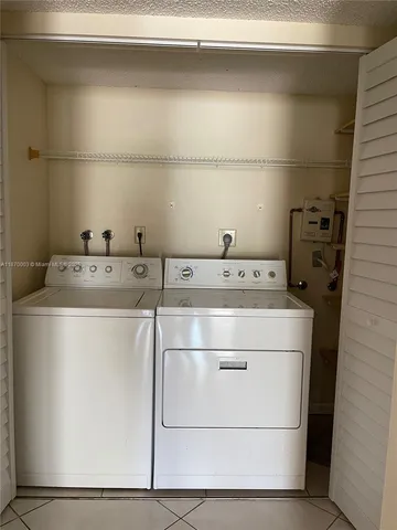 a view of a backyard with potted plants