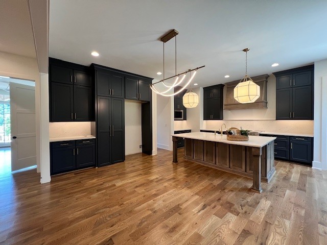 9493 Grand Haven Drive Brentwood, TN 37027 - Photo 25 of 37 a large open kitchen with a refrigerator a stove and a wooden floors