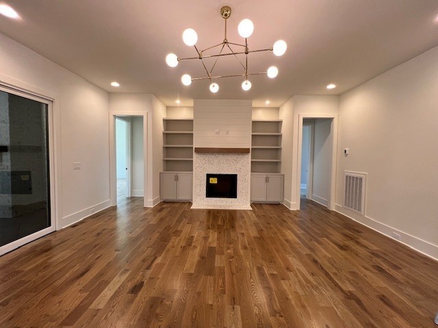 9493 Grand Haven Drive Brentwood, TN 37027 - Photo 26 of 37 a view of a room with wooden floor and a fireplace