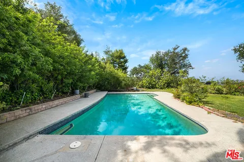 a view of a back yard of the house