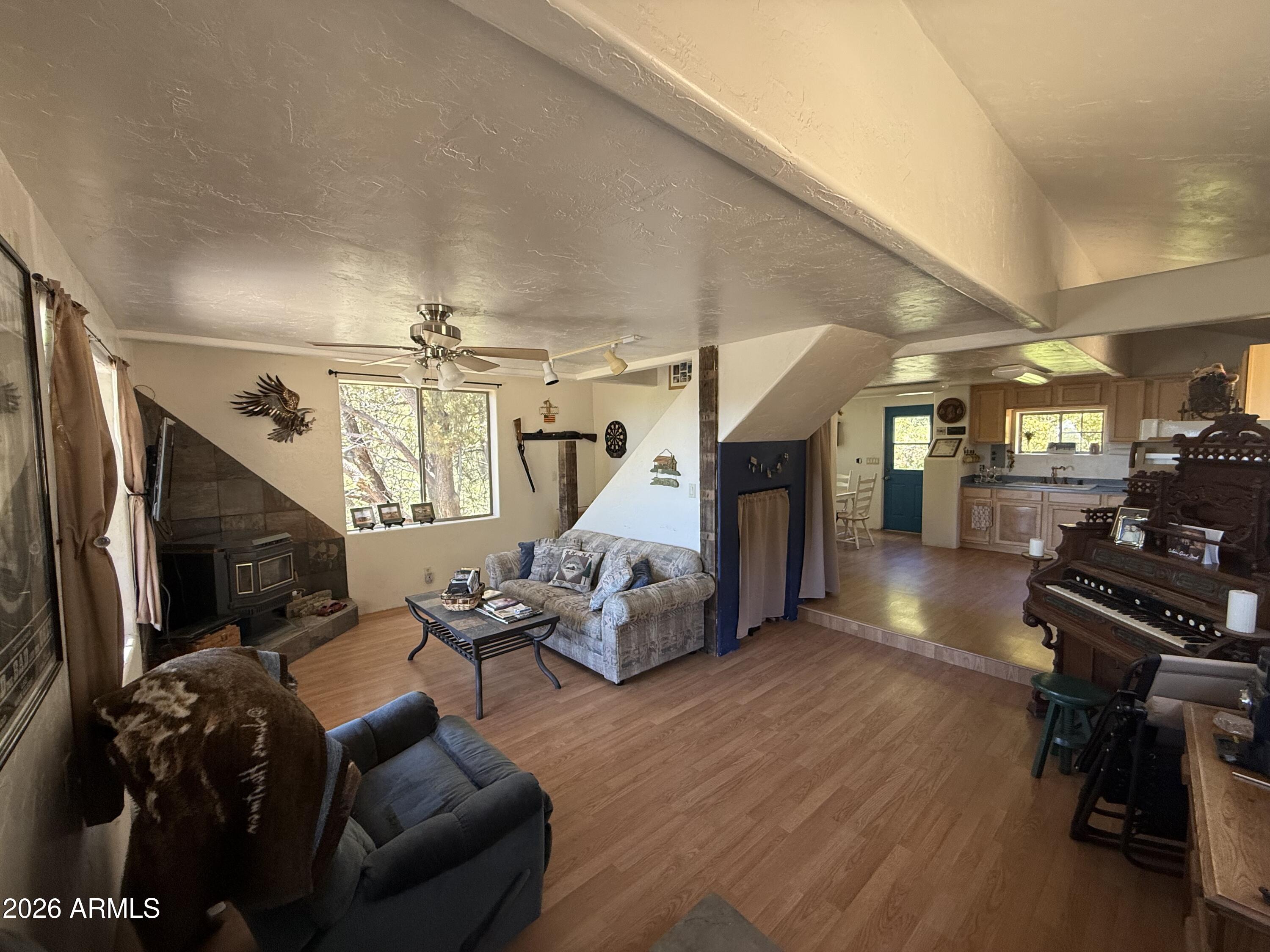 22406 South Eagle Mine Road Crown King, AZ 86343 - Photo 15 of 20 a living room with furniture and a flat screen tv