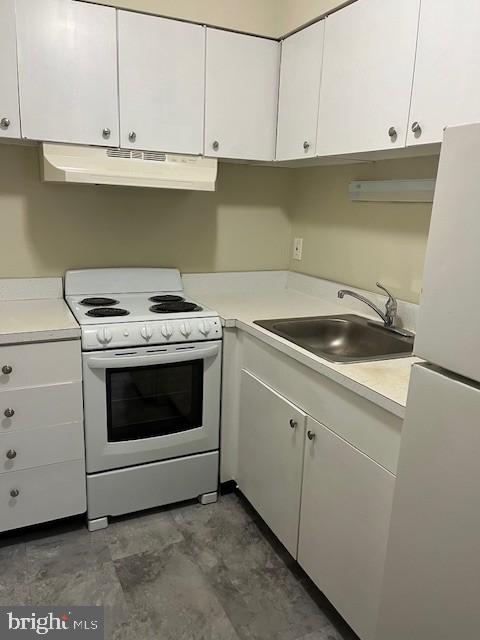 114 Park Avenue, Unit 5B Swarthmore, PA 19081 - Photo 4 of 9 a kitchen with cabinets appliances and a sink