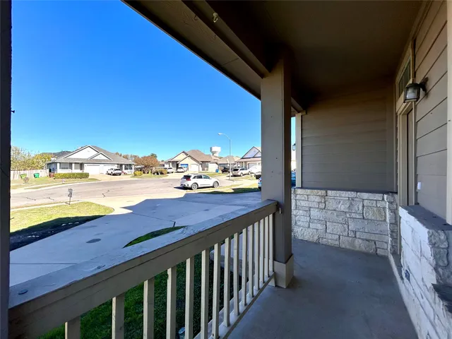 a view of swimming pool from a balcony