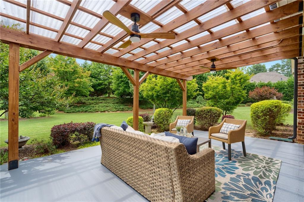 4735 Amble Trace Cumming, GA 30040 - Photo 55 of 73 a outdoor living space with furniture and garden view