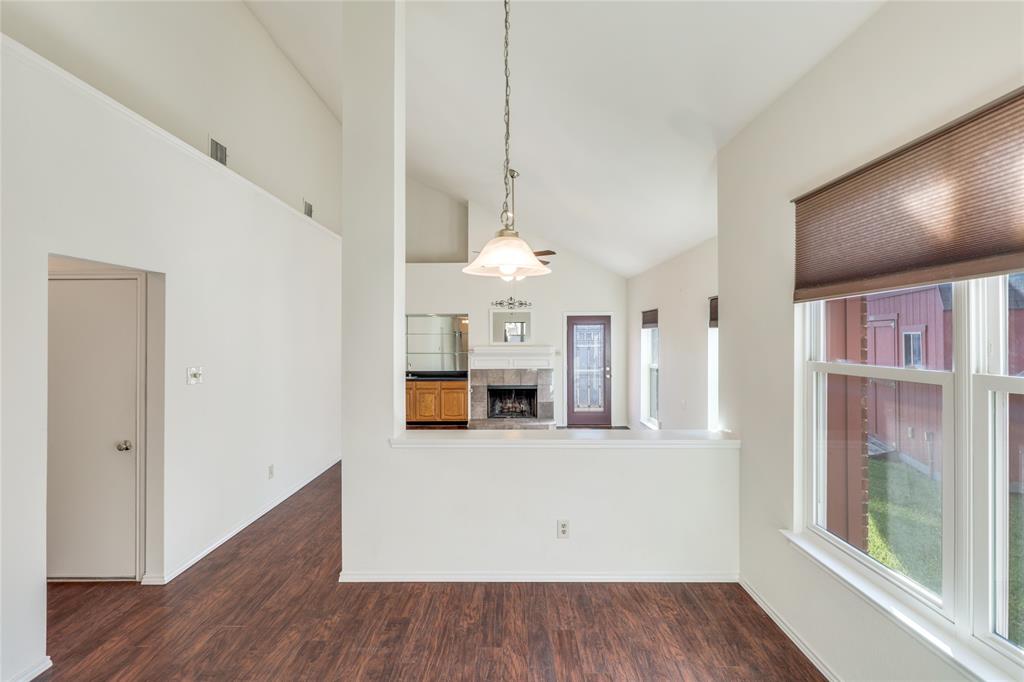 2151 Falcon Ridge Drive Carrollton, TX 75010 - Photo 11 of 40 a view of a kitchen with furniture and wooden floor