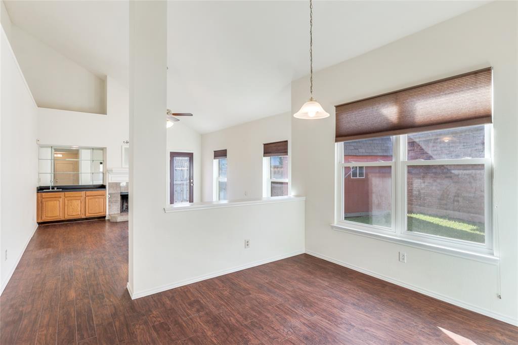 2151 Falcon Ridge Drive Carrollton, TX 75010 - Photo 12 of 40 a view of empty room with wooden floor and fan