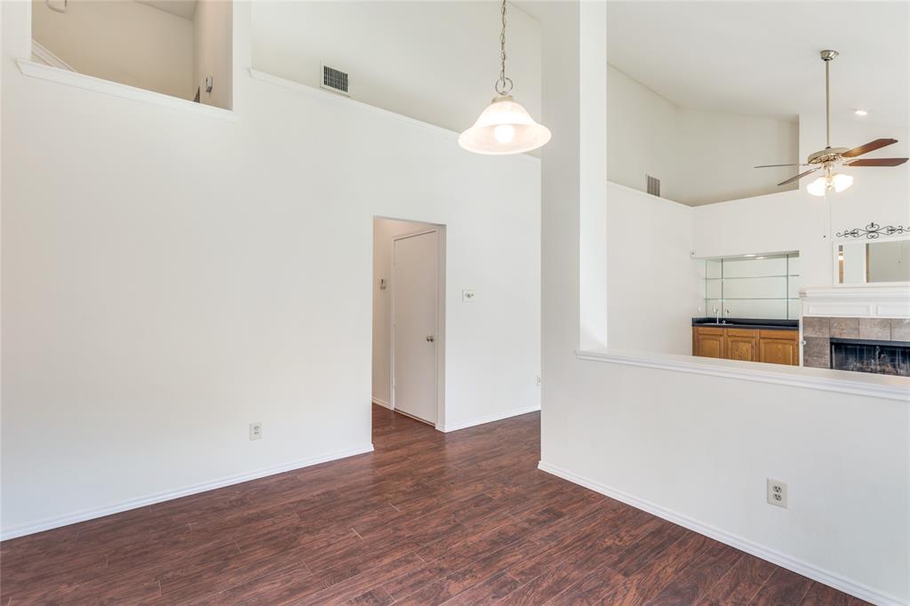 2151 Falcon Ridge Drive Carrollton, TX 75010 - Photo 13 of 40 an empty room with wooden floor