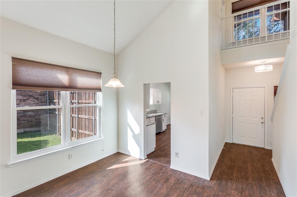 2151 Falcon Ridge Drive Carrollton, TX 75010 - Photo 2 of 40 a view of a kitchen with furniture and wooden floor
