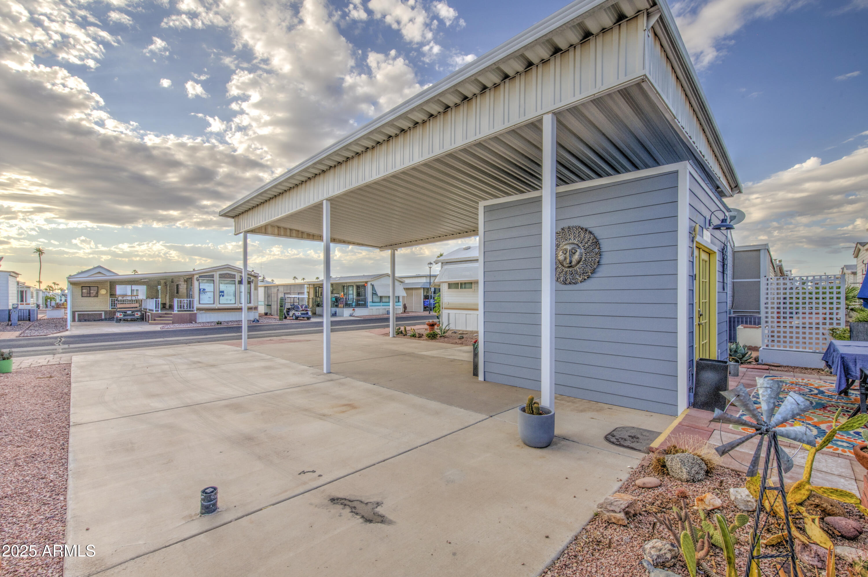 7750 East Broadway Road, Unit 287 Mesa, AZ 85208 - Photo 3 of 30 a view of a terrace with chairs