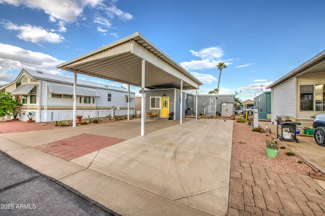 a view of a building with car parked