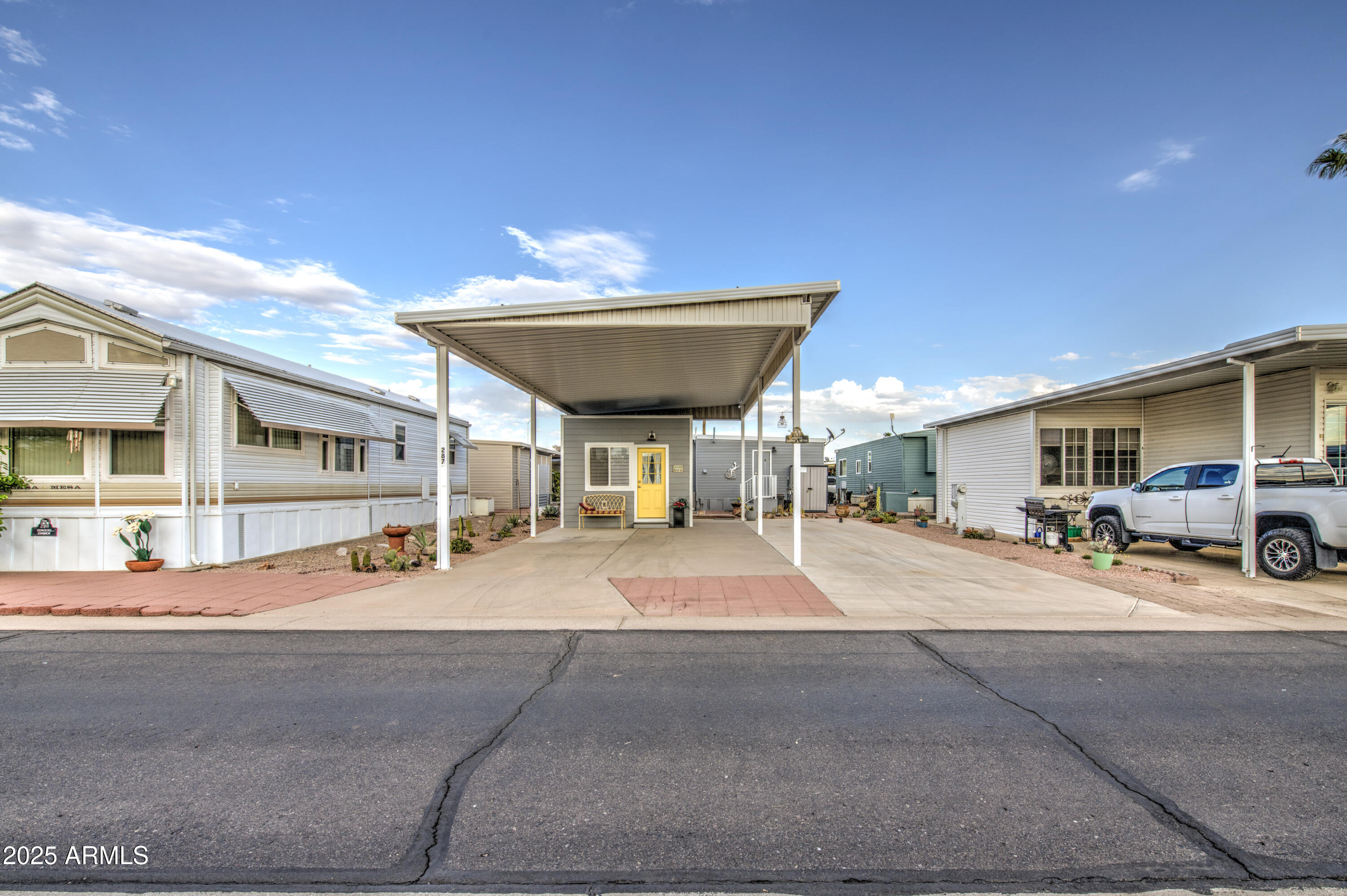 7750 East Broadway Road, Unit 287 Mesa, AZ 85208 - Photo 8 of 30 a view of a house with outdoor space and sitting area