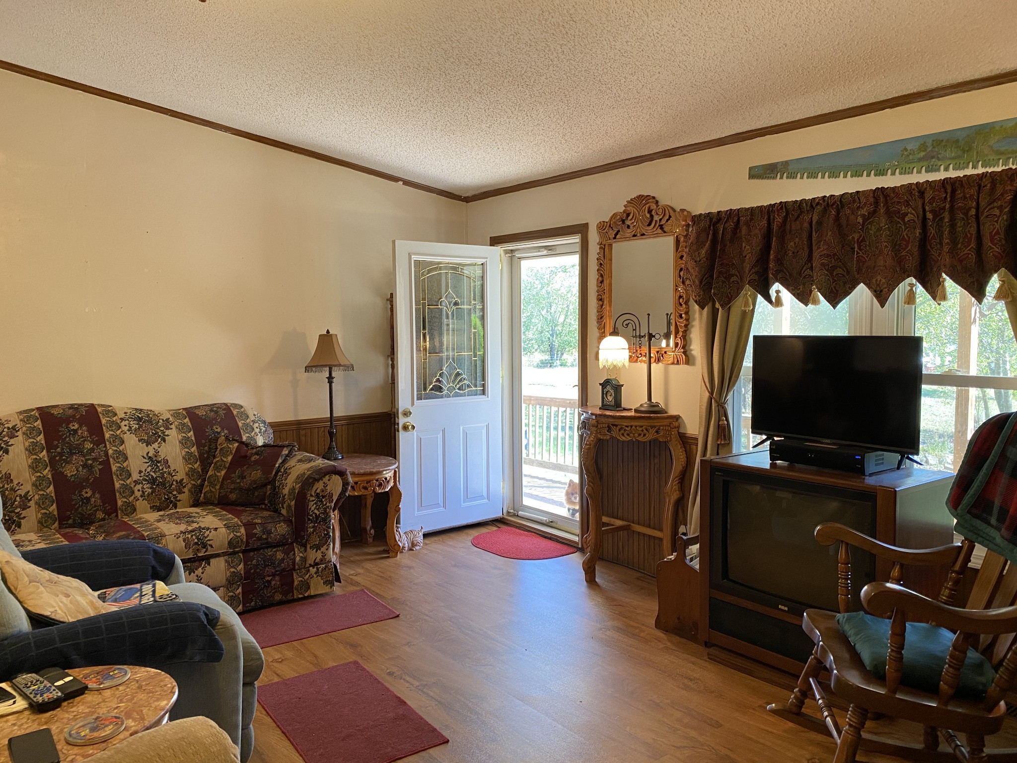 4008 Green Road Springfield, TN 37172 - Photo 14 of 24 a living room with furniture a flat screen tv and a fireplace