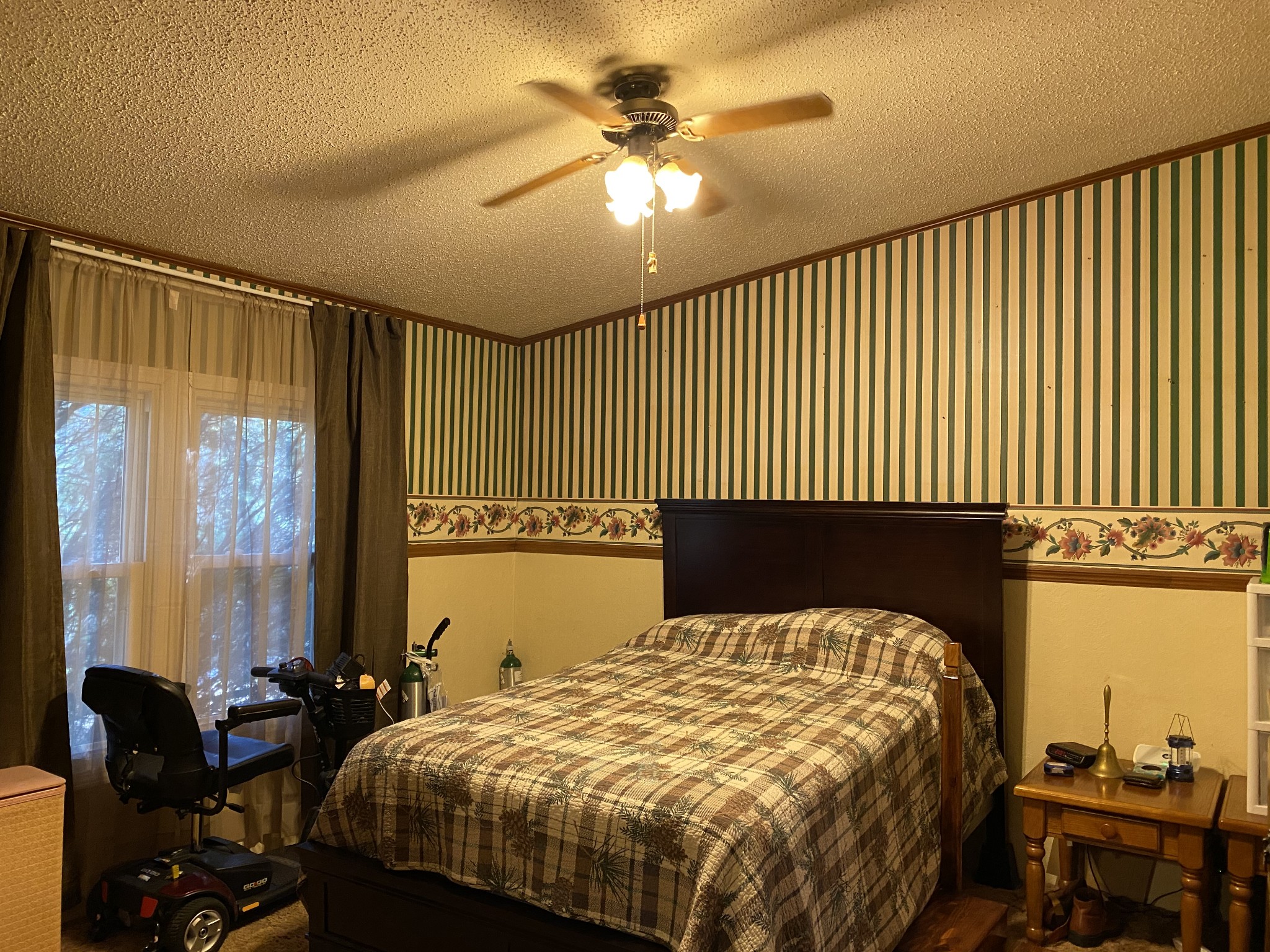 4008 Green Road Springfield, TN 37172 - Photo 17 of 24 a bedroom with a bed and a chandelier