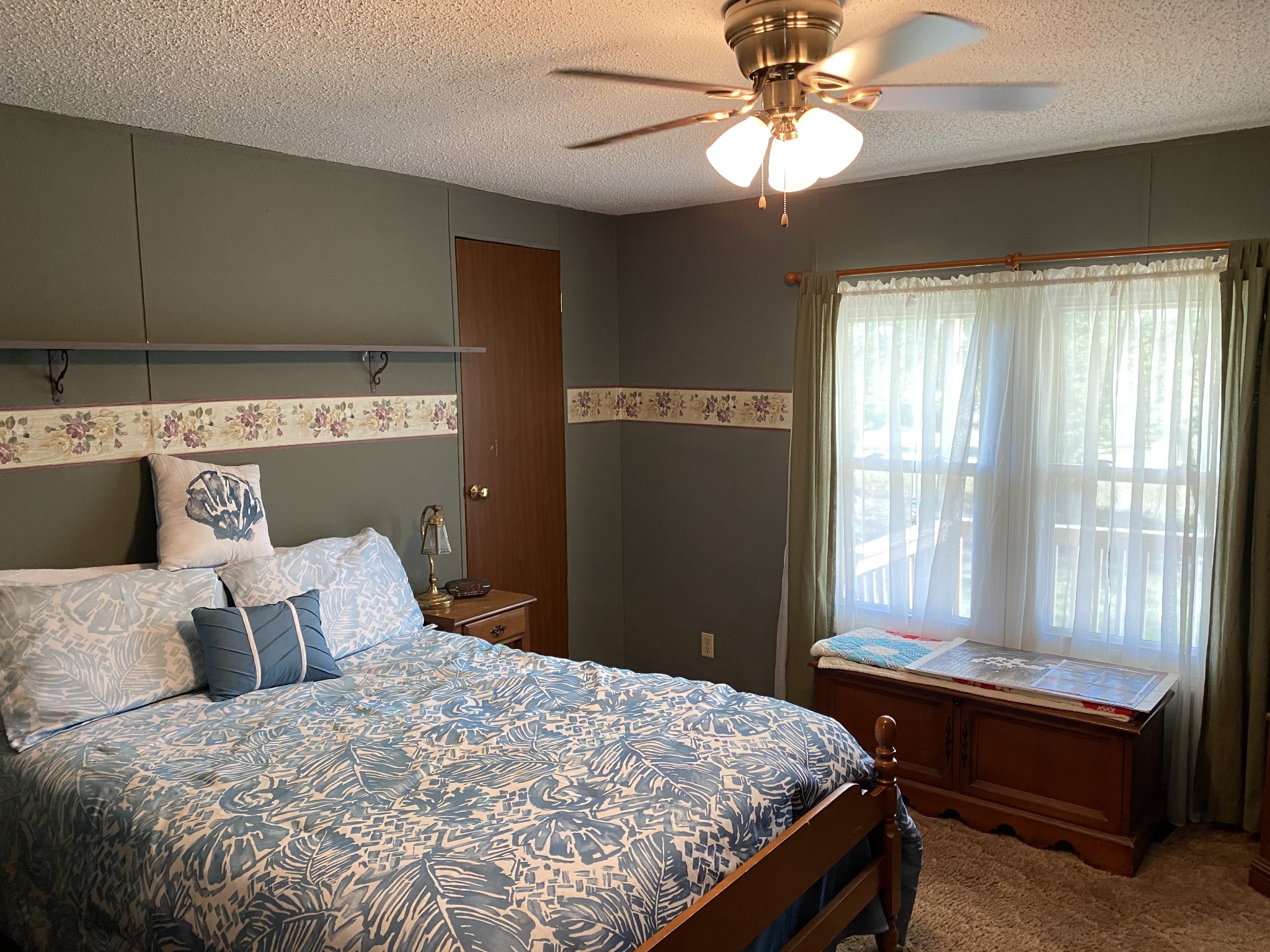 4008 Green Road Springfield, TN 37172 - Photo 18 of 24 a bedroom with a bed and a chandelier