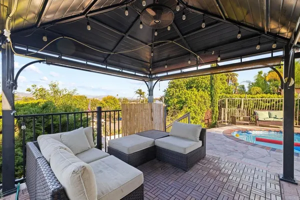 a view of a terrace with sitting area