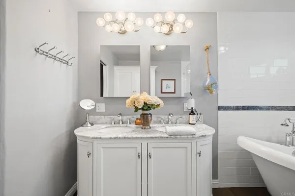 a bathroom with a bathtub and a shower