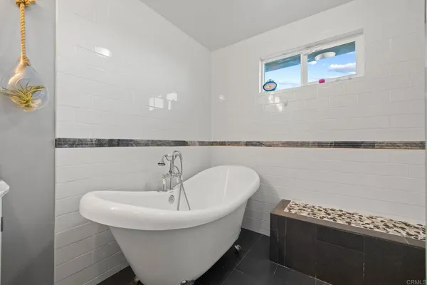 a bathroom with a sink vanity mirror and toilet