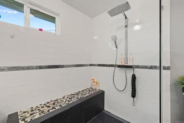 a bathroom with a shower and a toilet