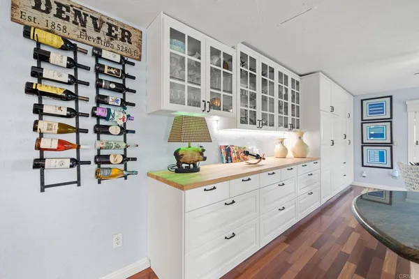 a kitchen with stainless steel appliances granite countertop a sink and a refrigerator