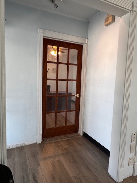 1326 Almeda Genoa Road Houston, TX 77047 - Photo 14 of 24 a view of an empty room with wooden floor and a window