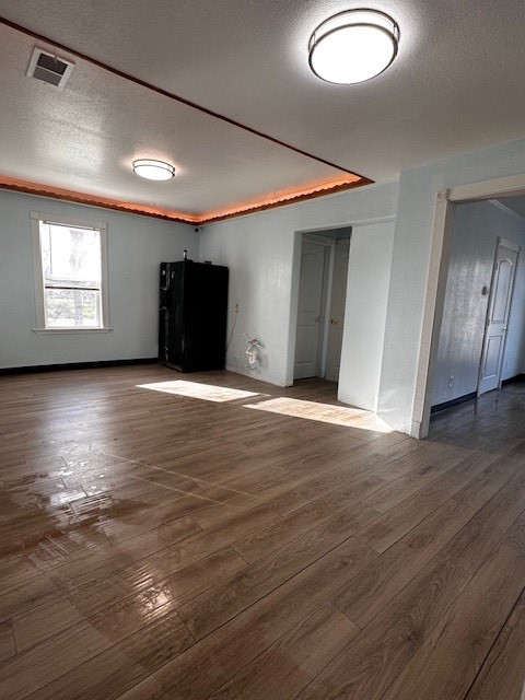 1326 Almeda Genoa Road Houston, TX 77047 - Photo 16 of 24 an empty room with wooden floor and windows