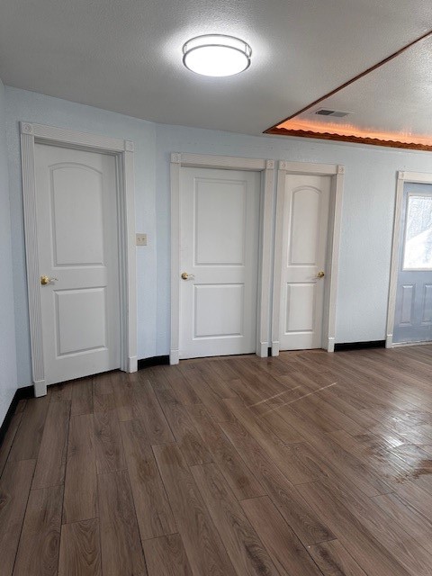 1326 Almeda Genoa Road Houston, TX 77047 - Photo 18 of 24 an empty room with wooden floor and windows
