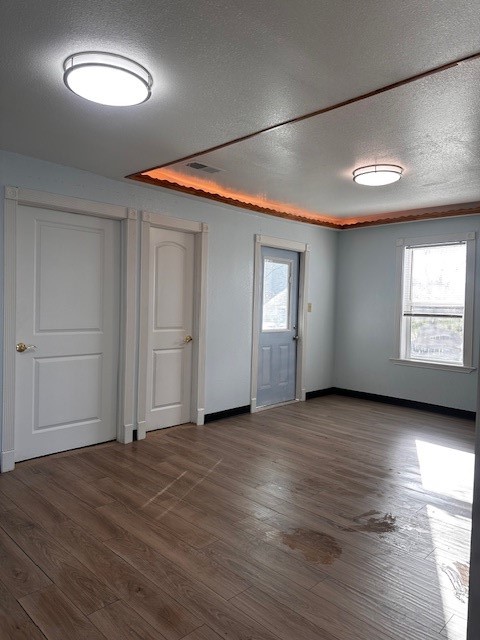 1326 Almeda Genoa Road Houston, TX 77047 - Photo 19 of 24 an empty room with wooden floor and windows
