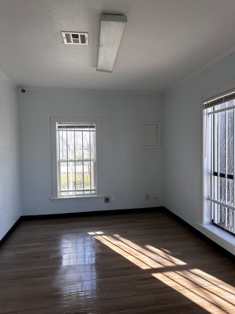 1326 Almeda Genoa Road Houston, TX 77047 - Photo 20 of 24 wooden floor in an empty room with a window