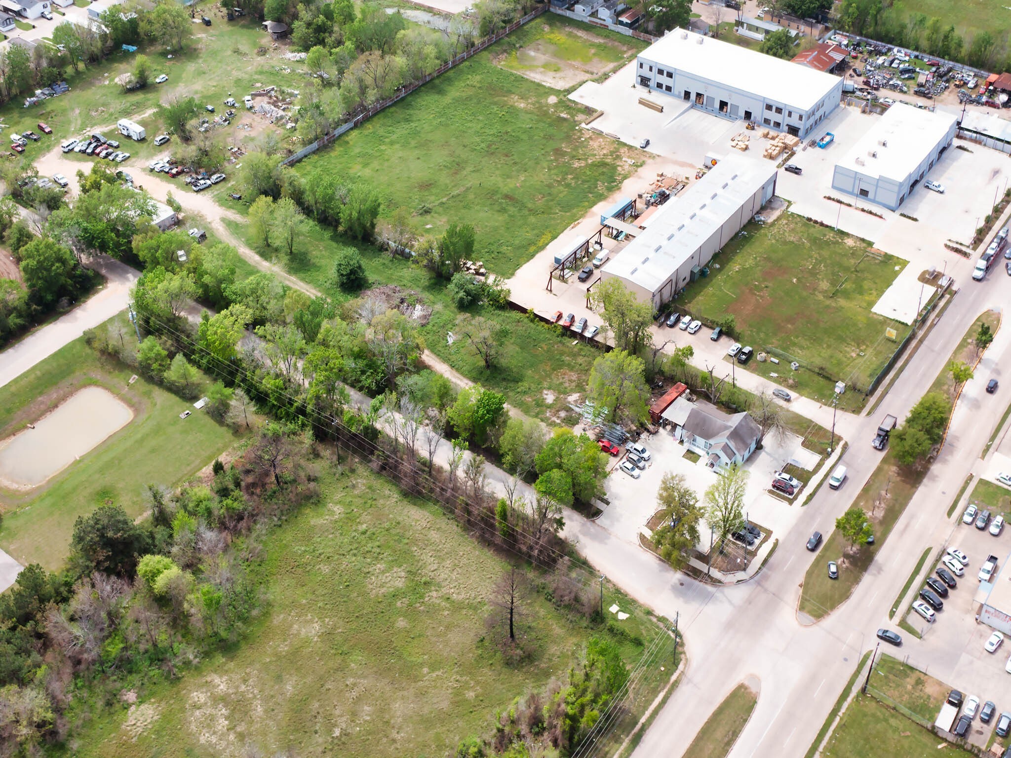 1326 Almeda Genoa Road Houston, TX 77047 - Photo 3 of 24 an aerial view of a house with a yard and lake view