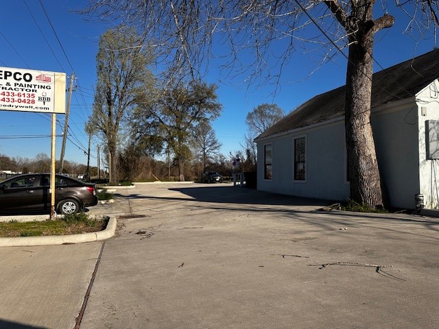 1326 Almeda Genoa Road Houston, TX 77047 - Photo 8 of 24 a view of a house with backyard and trees